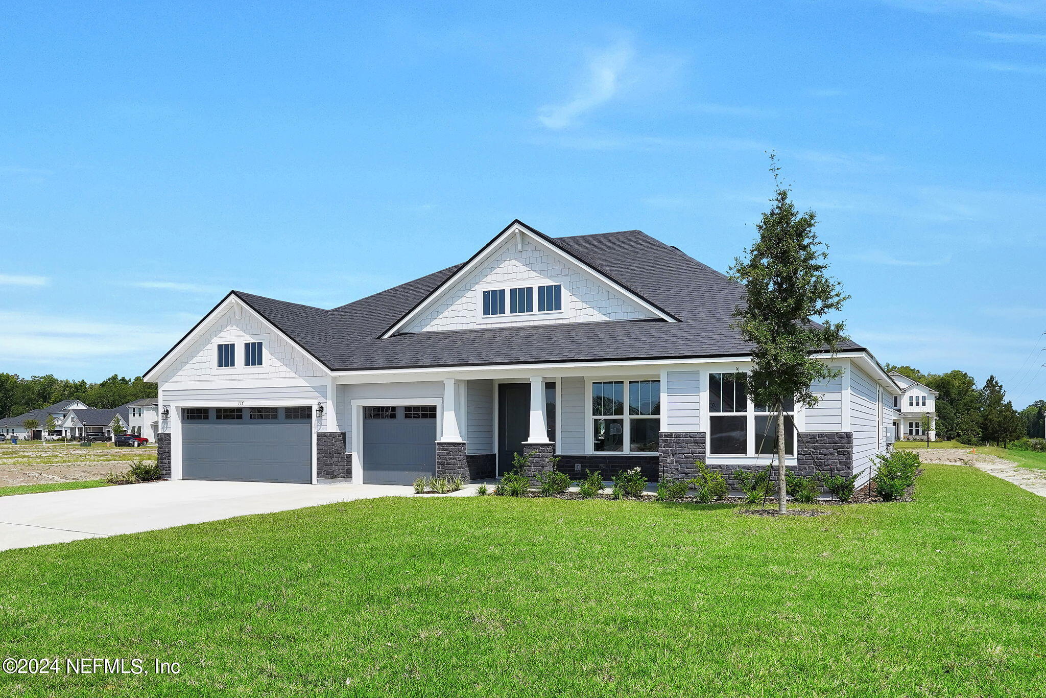 117 Greylock Lane St. Augustine, FL 32092 - Photo 5 of 48 a front view of a house with a yard and trees