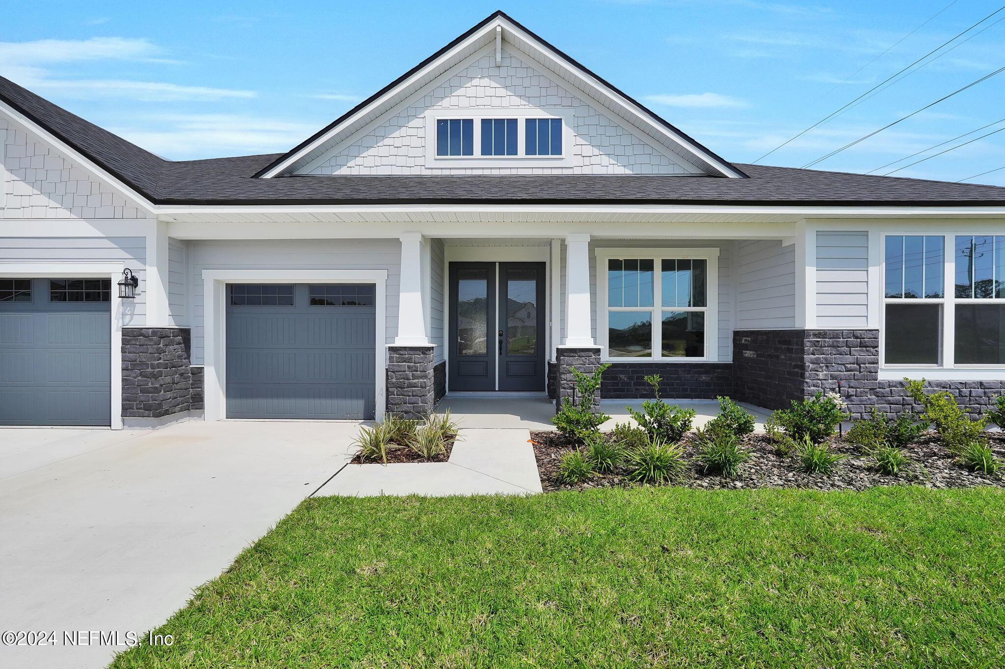 117 Greylock Lane St. Augustine, FL 32092 - Photo 6 of 48 a front view of a house with a yard and potted plants
