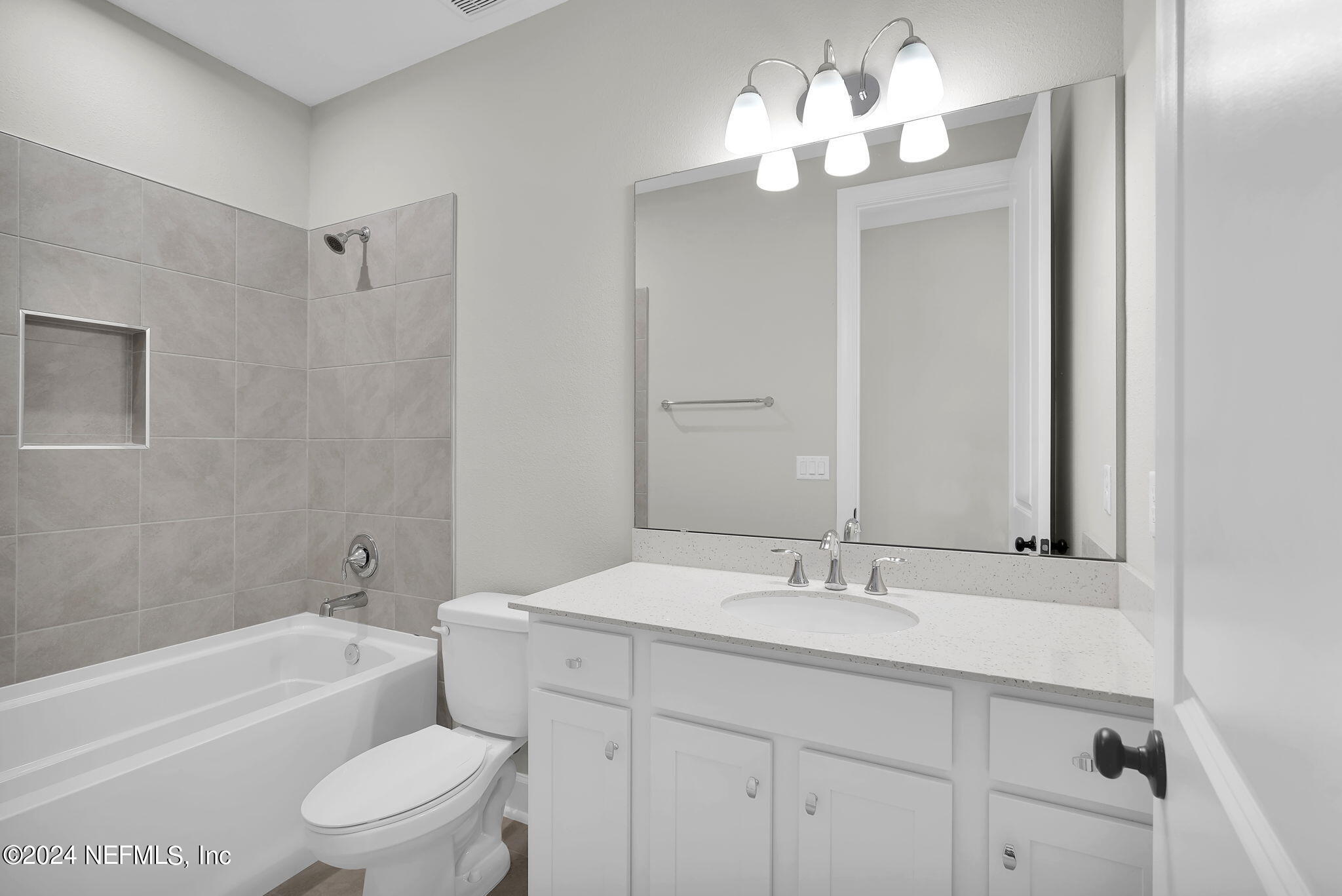 117 Greylock Lane St. Augustine, FL 32092 - Photo 10 of 48 a bathroom with a toilet a sink a tub and a mirror