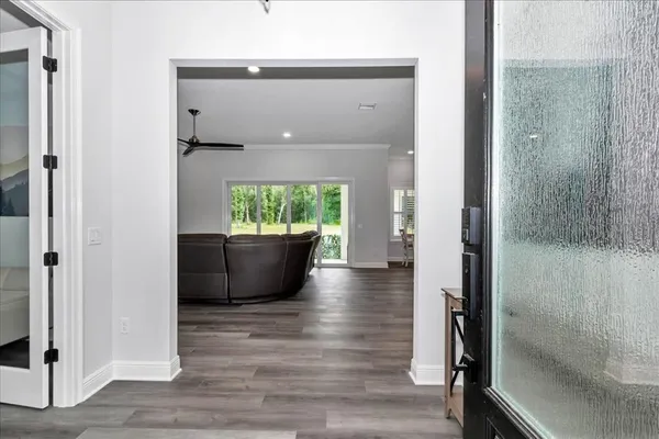 a view of an empty room and wooden floor