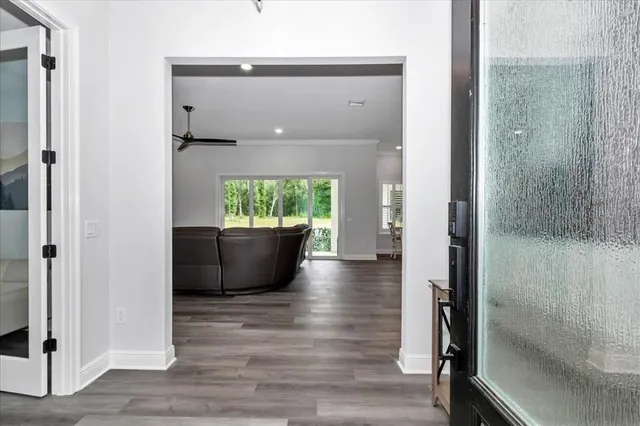 a view of an empty room and wooden floor