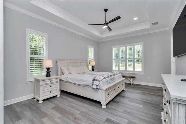 a bedroom with a large bed and a window