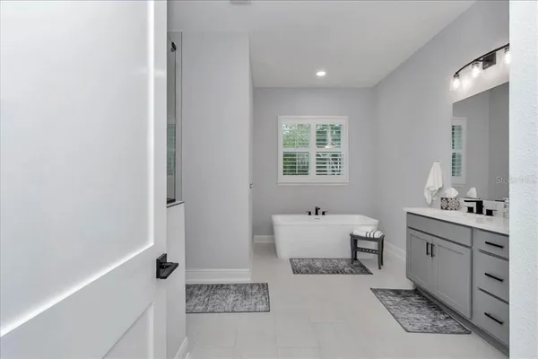 a room with a bed and a window