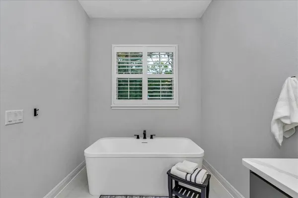 a bathroom with a sink and a window