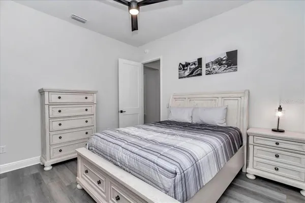 a bedroom with a bed and a dresser