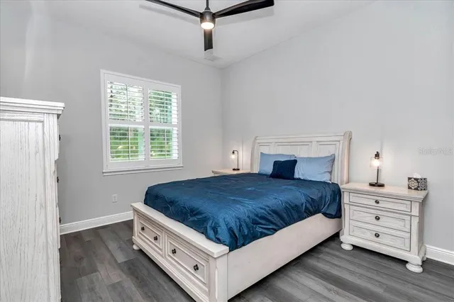 a living room with bed and a window