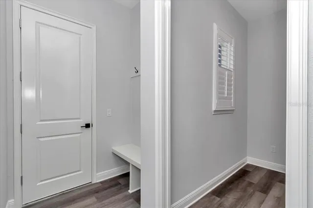 a view of front door with wooden floor