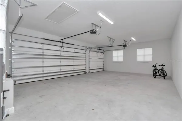 a view of a big room with windows and closet