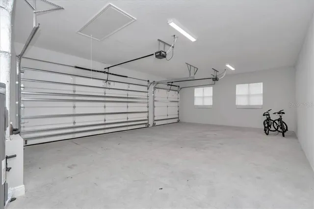 a view of a big room with windows and closet