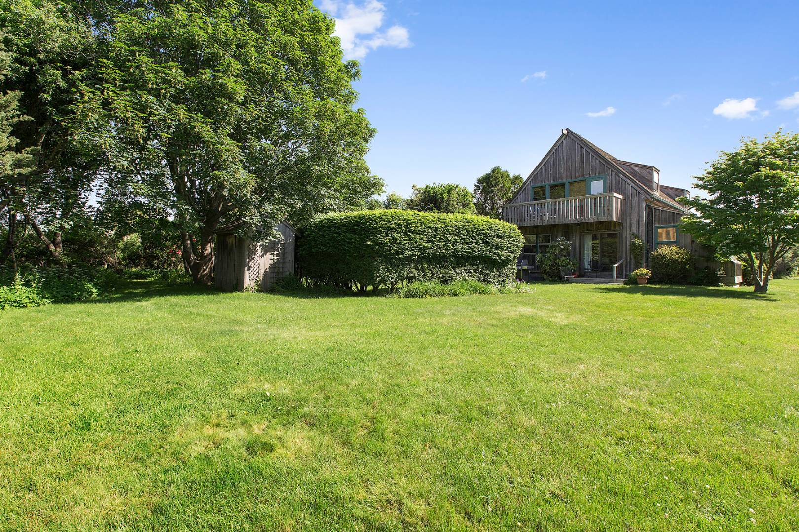 172 Town Line Road Sagaponack, NY 11962 - Photo 3 of 5 a front view of house with yard and green space