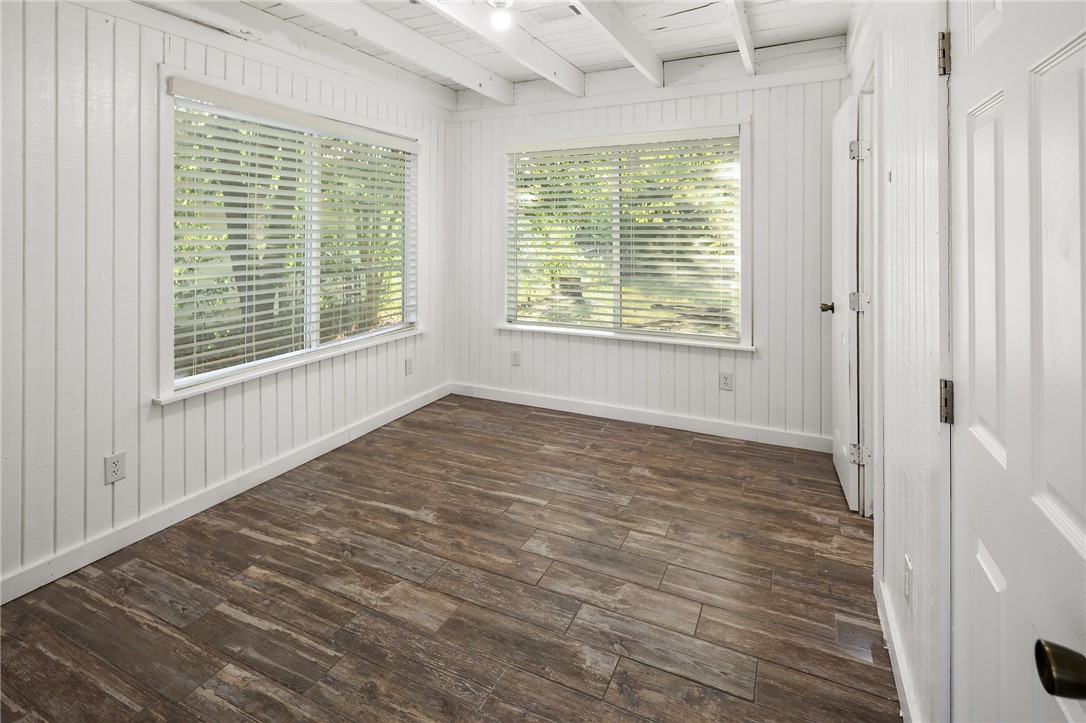 105 South Brown Street Bryan, TX 77802 - Photo 11 of 20 a big room with wooden floor and windows