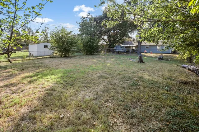 a fire hydrant in the middle of a field