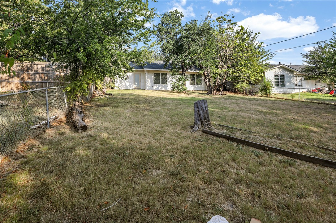 105 South Brown Street Bryan, TX 77802 - Photo 19 of 20 a view of a house with a yard