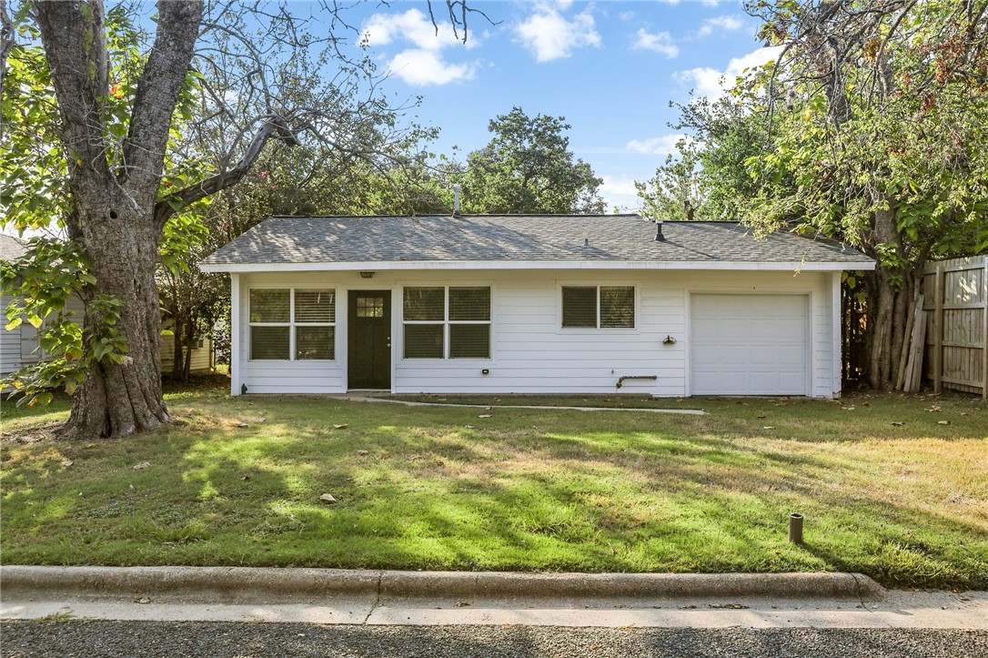 105 South Brown Street Bryan, TX 77802 - Photo 2 of 20 a view of a house with a yard