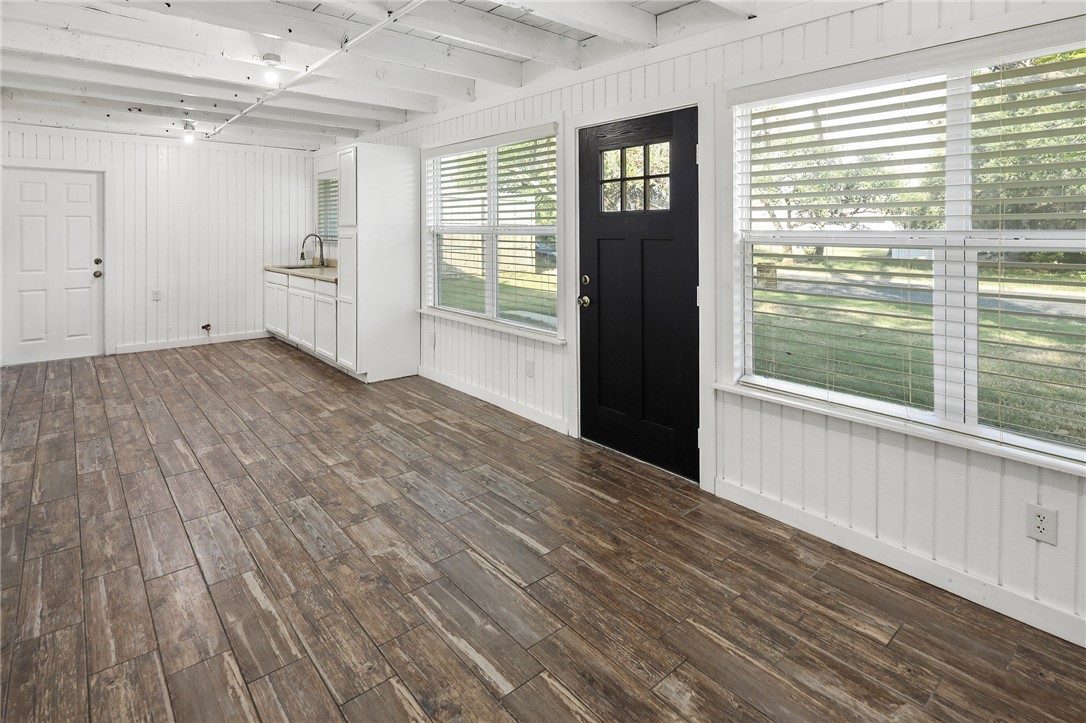 105 South Brown Street Bryan, TX 77802 - Photo 6 of 20 a view of empty room with wooden floor and fan