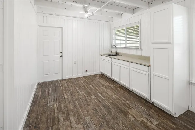 a view of a kitchen from the hallway