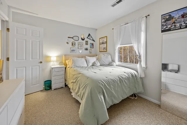 a bedroom with a bed and a cabinets
