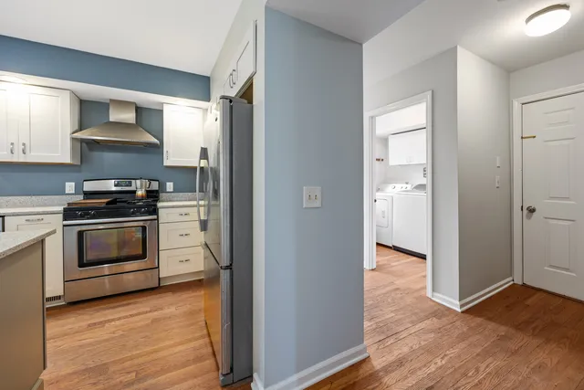 a kitchen with stainless steel appliances a stove and a refrigerator