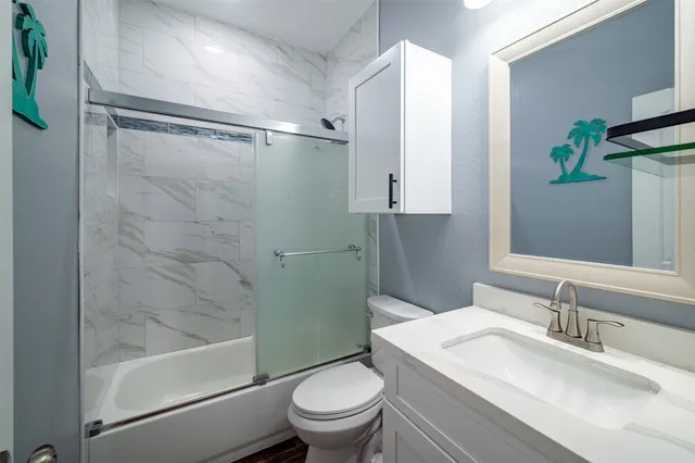 a kitchen with a refrigerator a stove and a cabinets