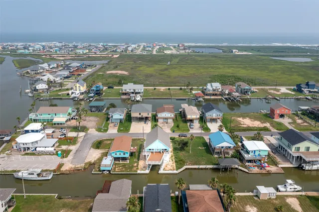 an aerial view of houses with outdoor space