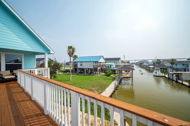 a view of a balcony with furniture