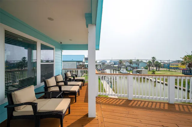 a view of an entryway with floor to ceiling windows