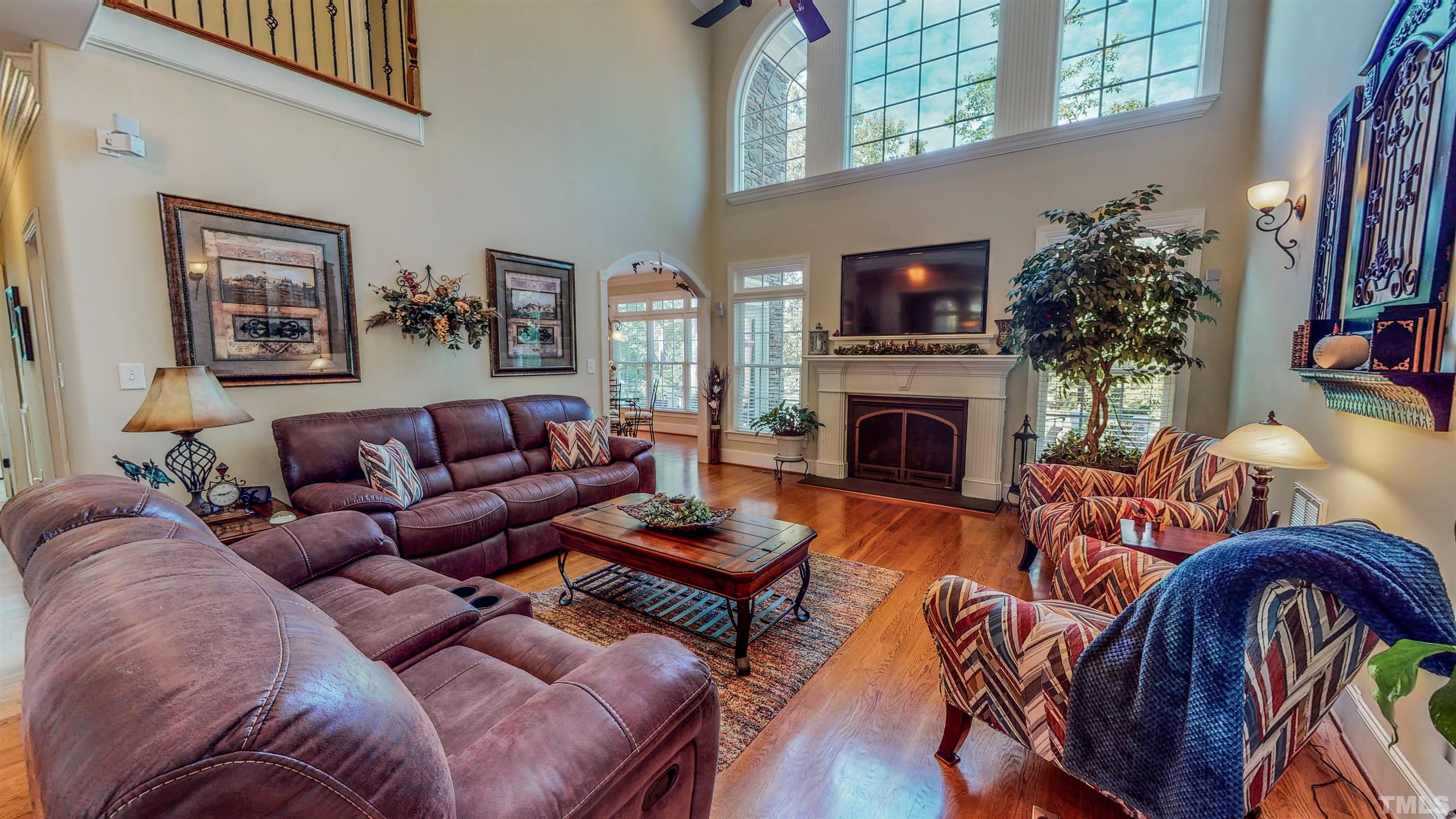 102 Continental Drive Durham, NC 27712 - Photo 11 of 86 a living room with fireplace furniture and a flat screen tv