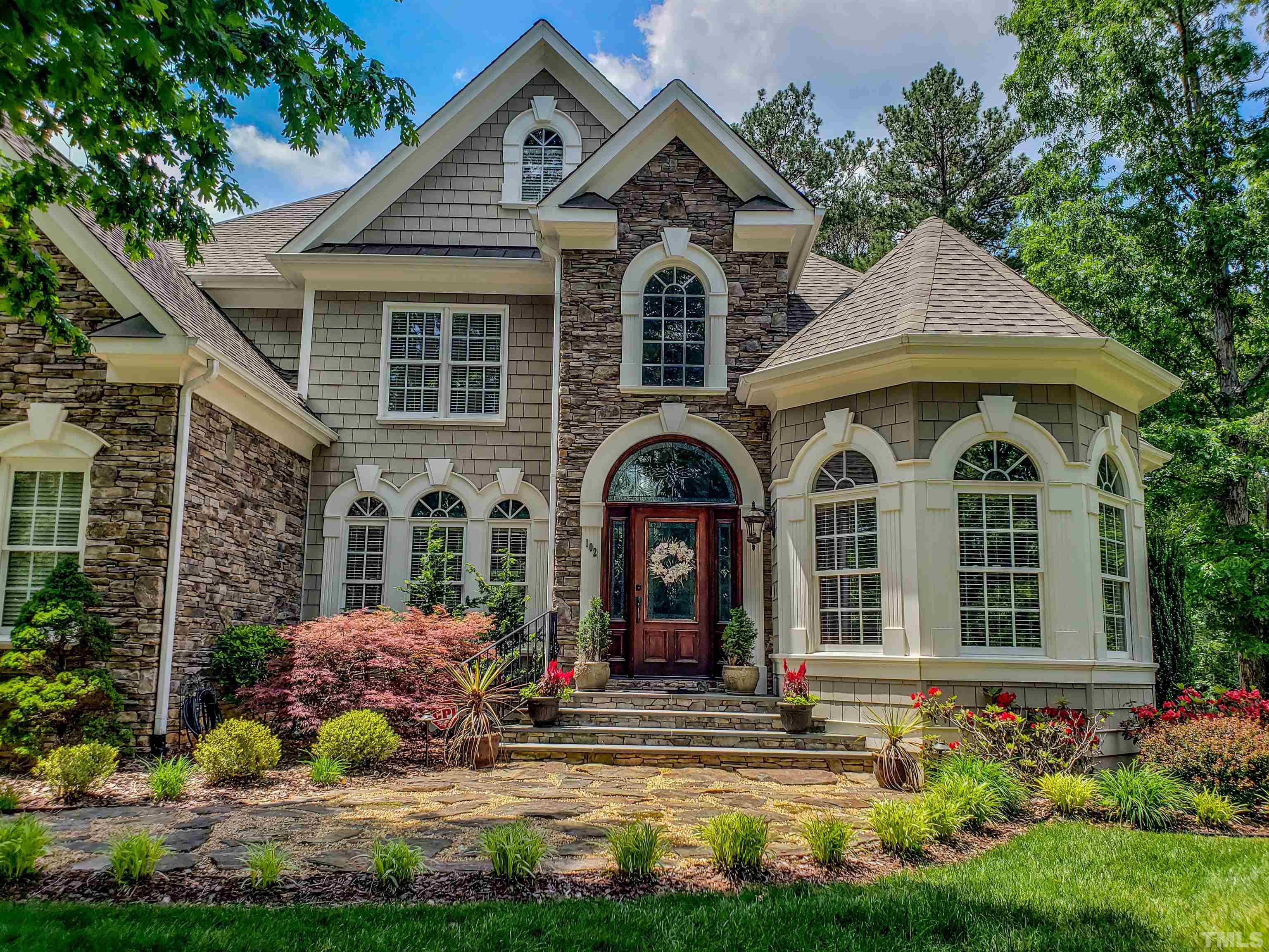 102 Continental Drive Durham, NC 27712 - Photo 14 of 86 a front view of a house with a garden