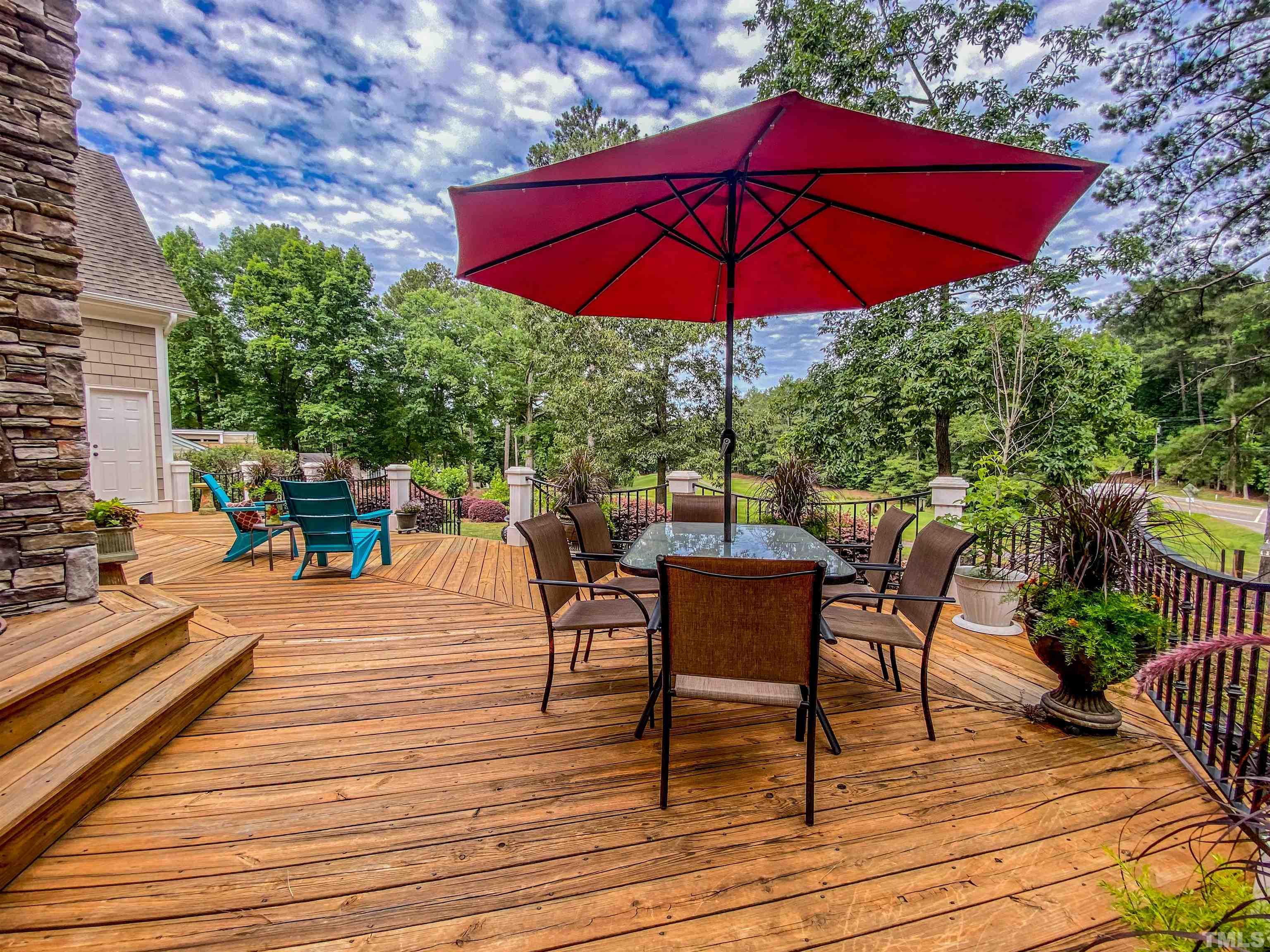 102 Continental Drive Durham, NC 27712 - Photo 26 of 86 a view of a roof deck with table and chairs under an umbrella
