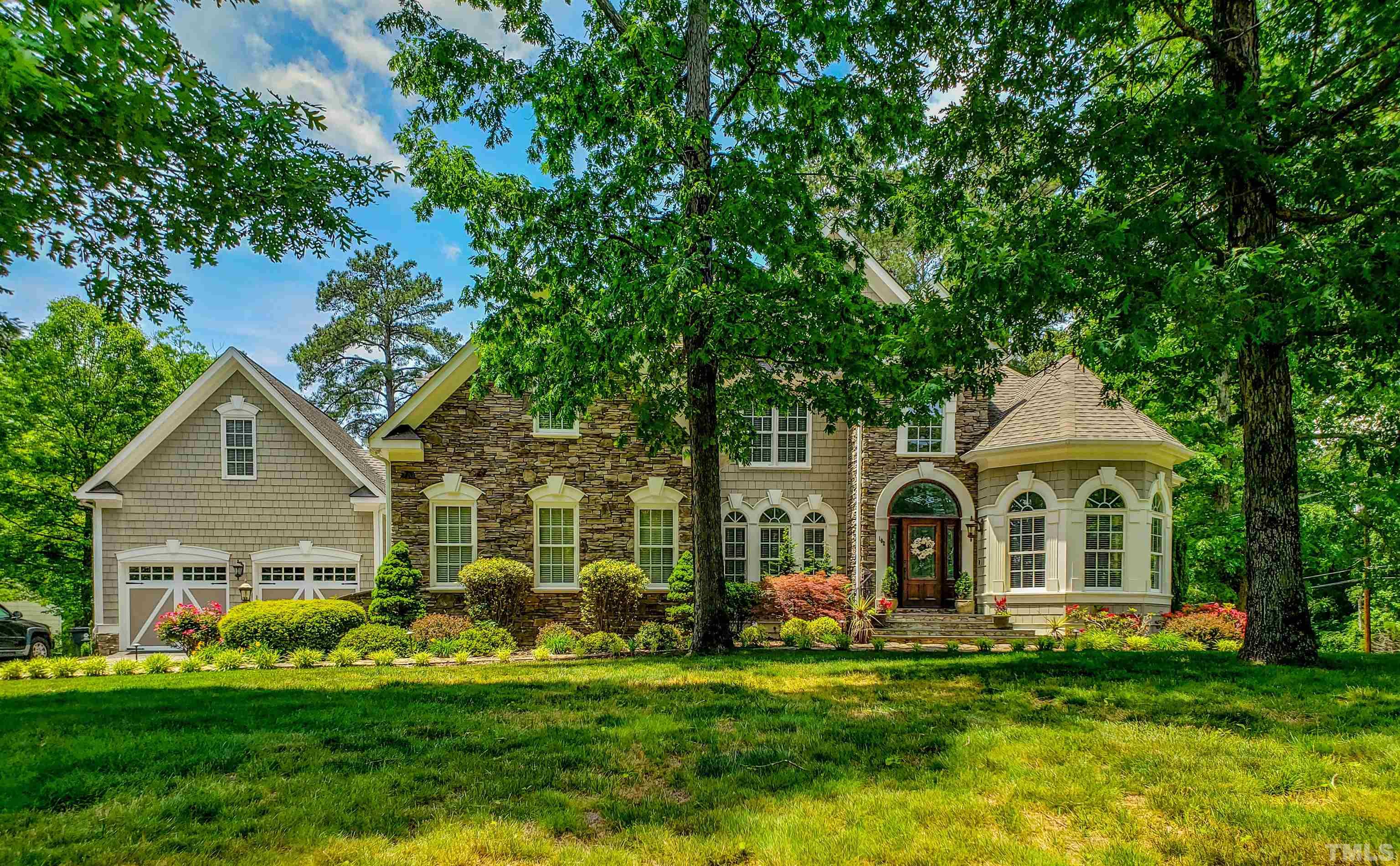 102 Continental Drive Durham, NC 27712 - Photo 31 of 86 a front view of a house with a garden