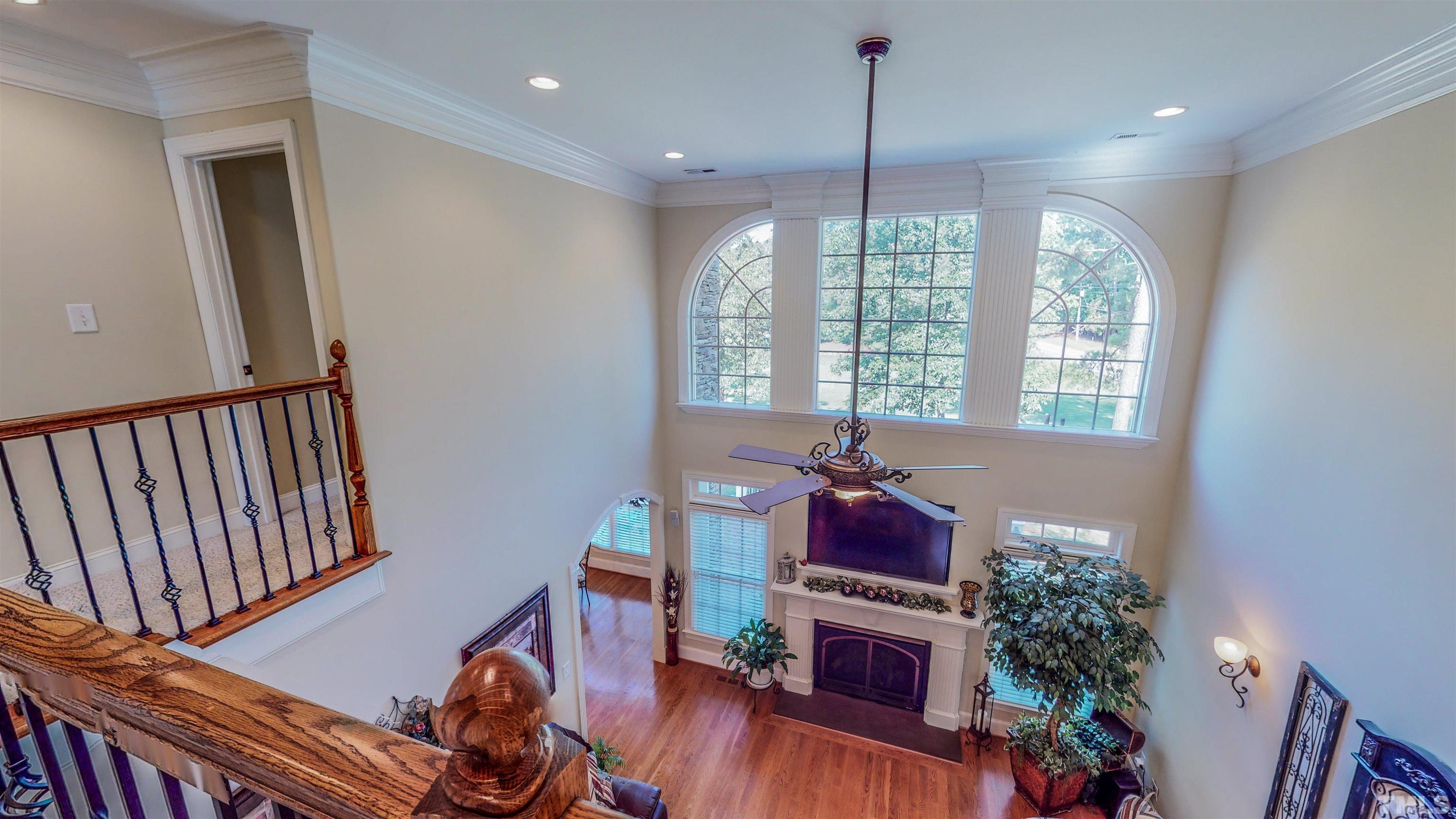 102 Continental Drive Durham, NC 27712 - Photo 36 of 86 a living room with furniture and a wooden floor