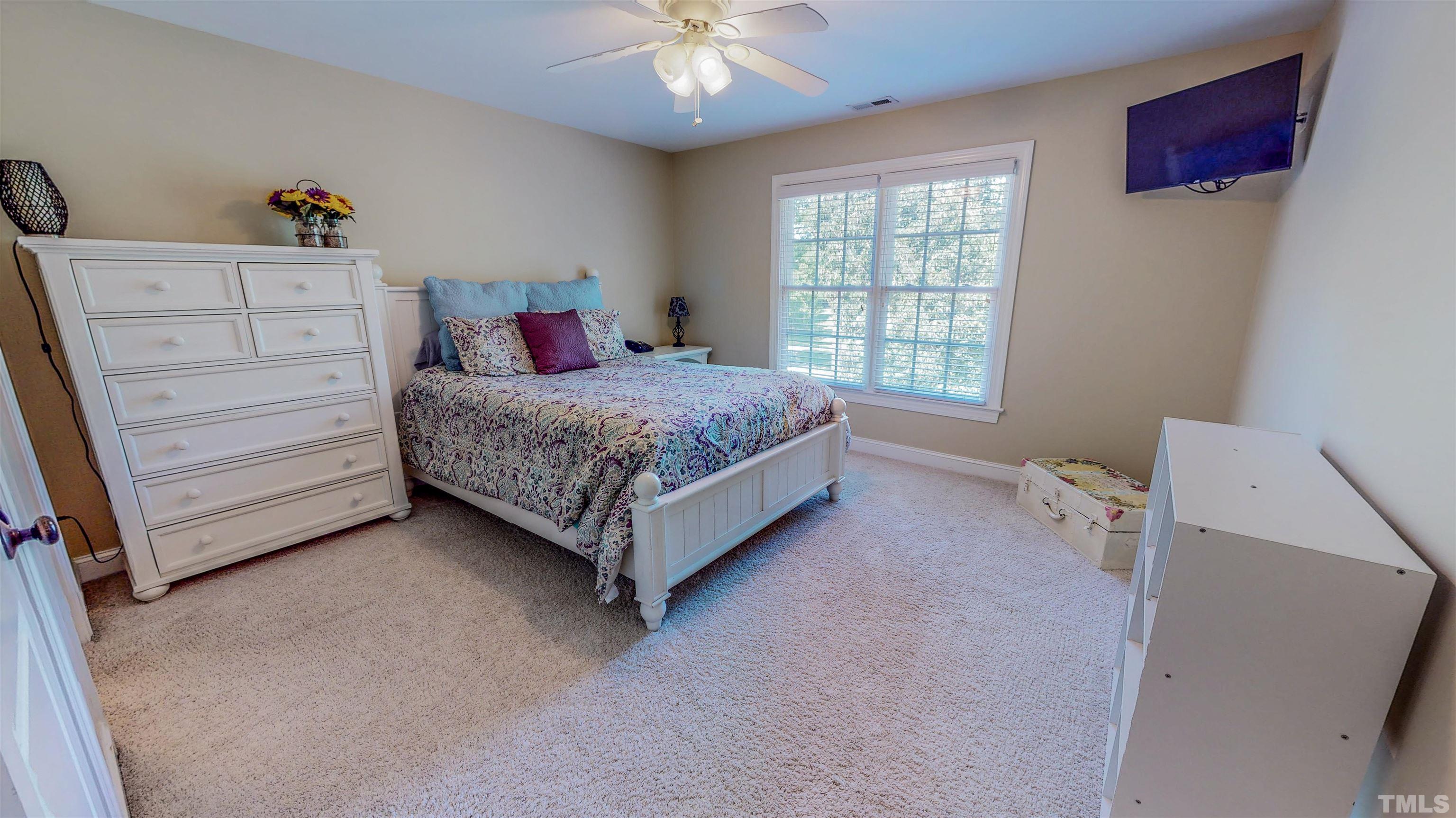 102 Continental Drive Durham, NC 27712 - Photo 39 of 86 a spacious bedroom with a bed and a window