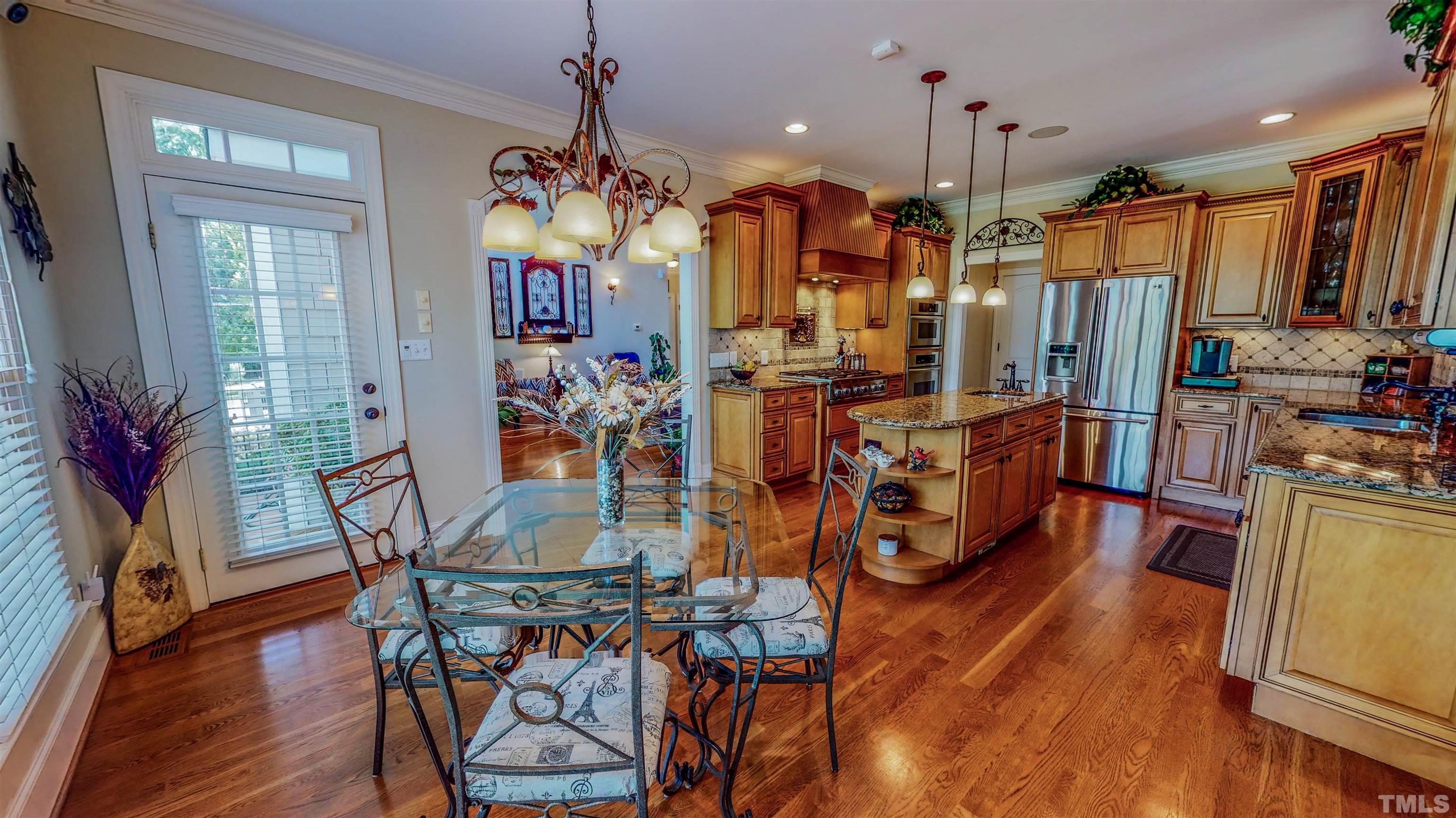 102 Continental Drive Durham, NC 27712 - Photo 4 of 86 a view of a dining room with furniture window and wooden floor
