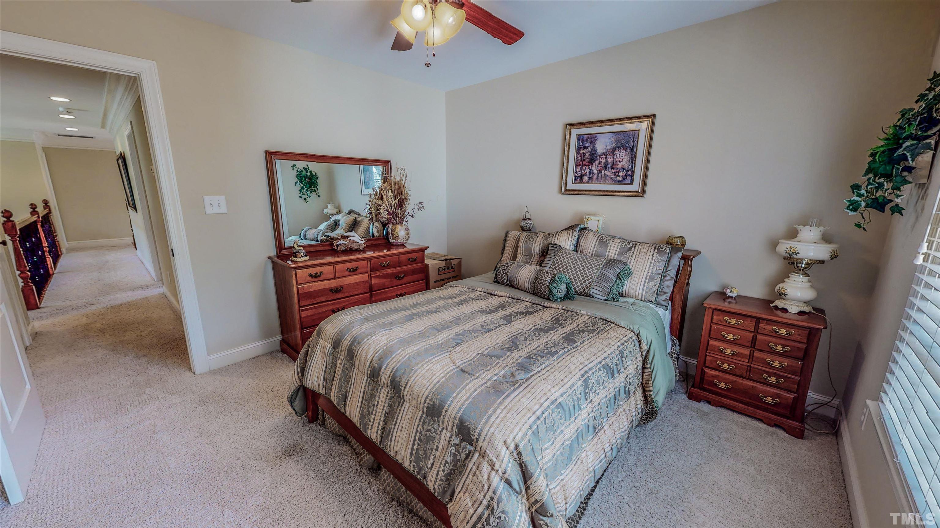 102 Continental Drive Durham, NC 27712 - Photo 44 of 86 a bedroom with a bed and a chandelier