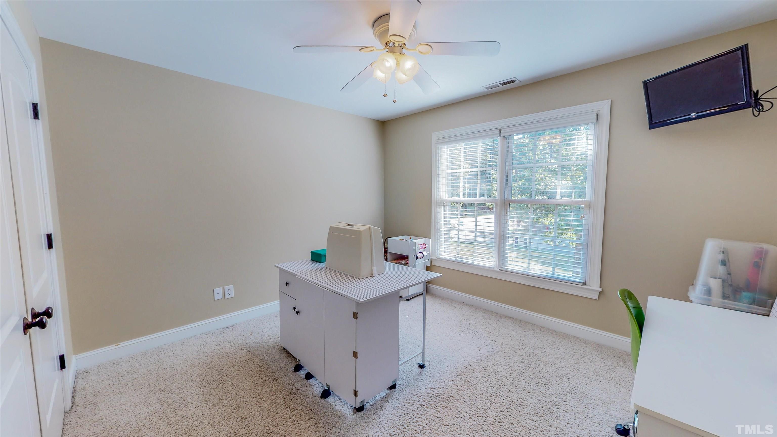 102 Continental Drive Durham, NC 27712 - Photo 48 of 86 a view of workspace with furniture and window