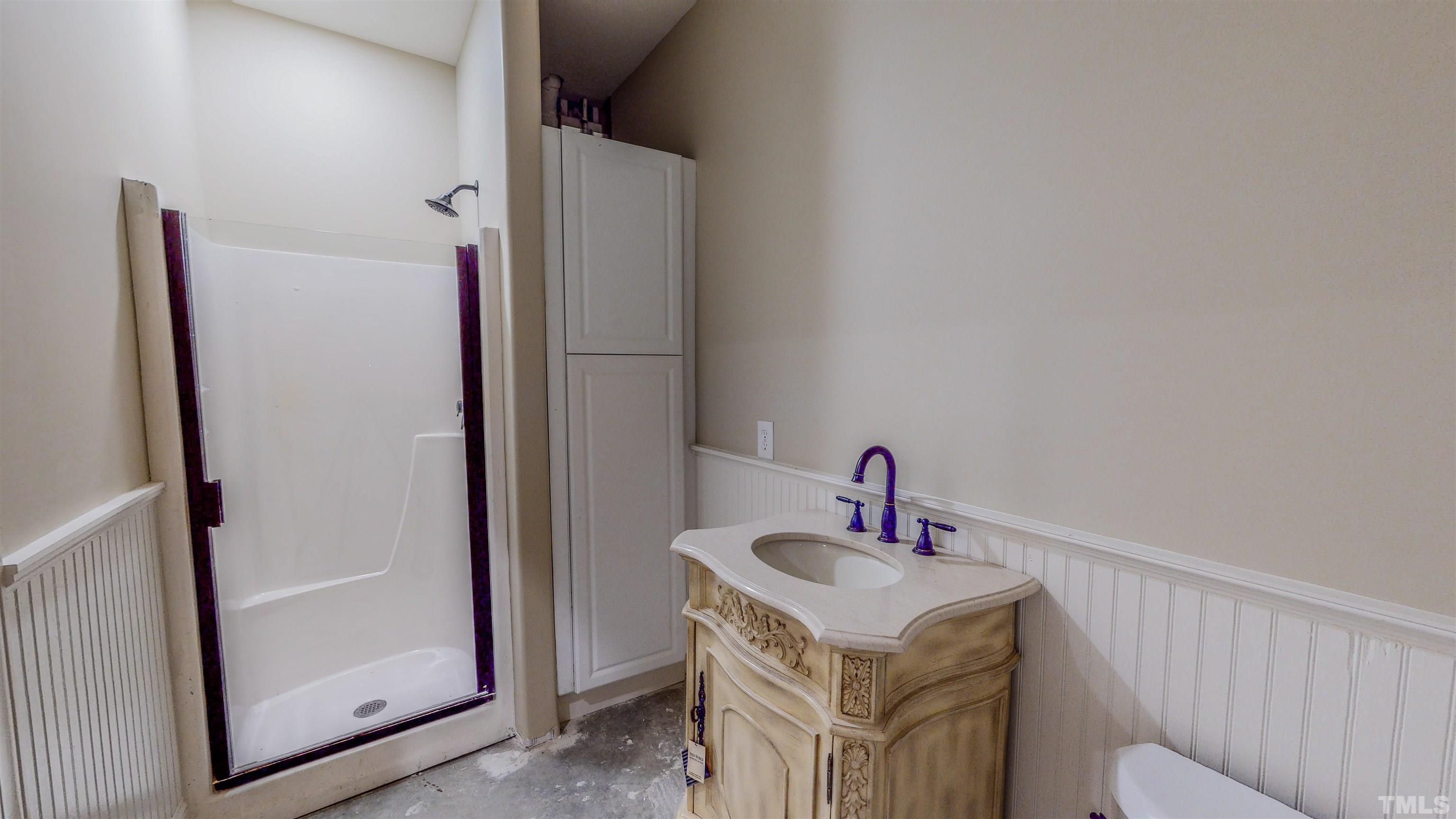102 Continental Drive Durham, NC 27712 - Photo 79 of 86 a bathroom with a sink and a mirror