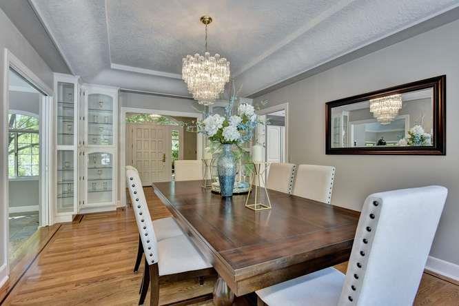 8380 Burchell Road Gilroy, CA 95020 - Photo 12 of 40 a view of a dining room with furniture wooden floor and chandelier