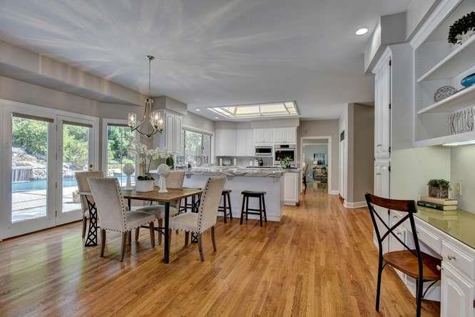 8380 Burchell Road Gilroy, CA 95020 - Photo 13 of 40 a view of a dining room with furniture window and wooden floor