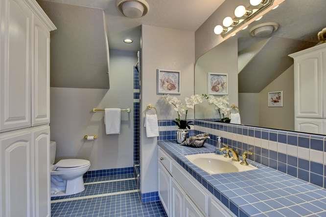 8380 Burchell Road Gilroy, CA 95020 - Photo 26 of 40 a bathroom with a granite countertop double vanity sink and a mirror