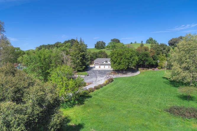 8380 Burchell Road Gilroy, CA 95020 - Photo 5 of 40 a view of a city with lush green forest