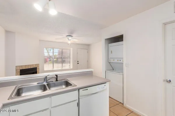 a kitchen with a sink and a refrigerator