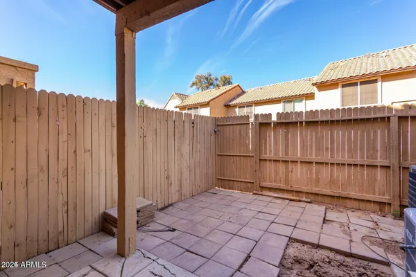 a view of a entrance gate with wooden fence