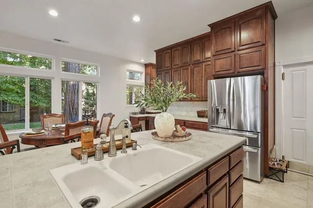 a kitchen with a sink and a refrigerator