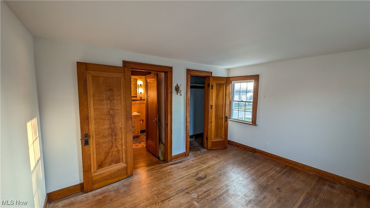2511 Milan Road Sandusky, OH 44870 - Photo 22 of 40 Unfurnished bedroom featuring hardwood / wood-style flooring