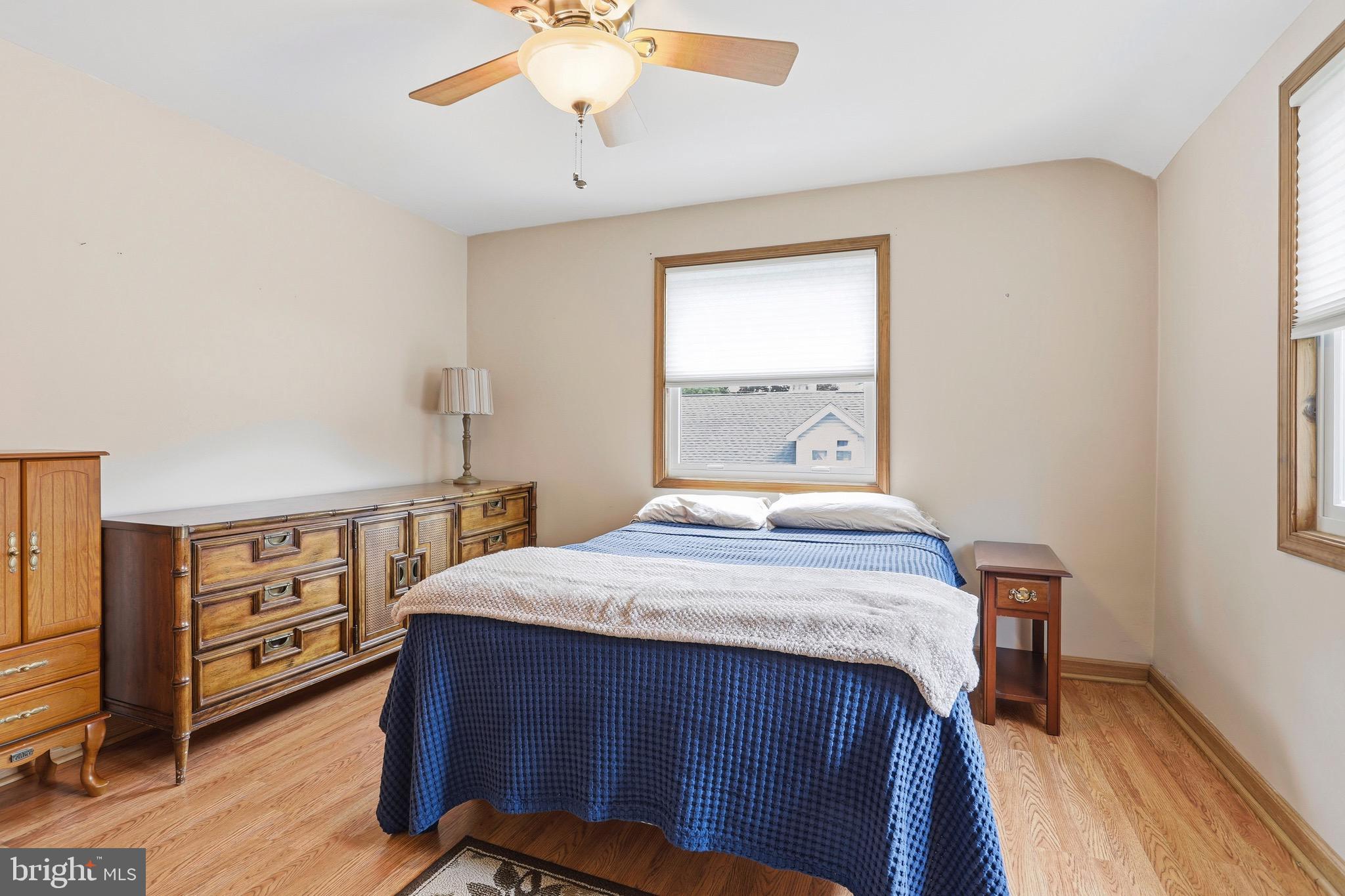 527 Saxer Avenue Springfield, PA 19064 - Photo 23 of 33 a bed sitting in a bedroom next to a window