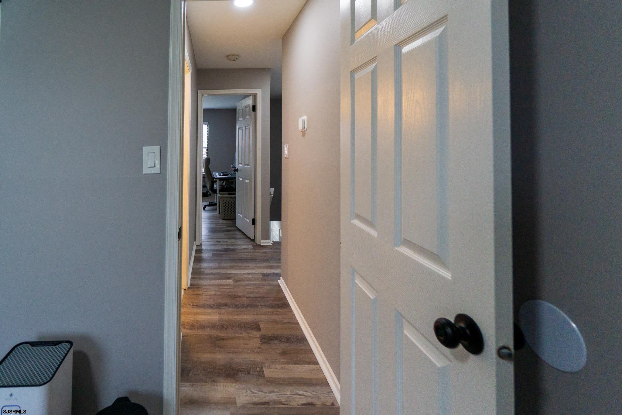 3137 Woodlands Drive, Unit 3137 Mays Landing, NJ 08330 - Photo 12 of 14 a view of a hallway with wooden floor and closet
