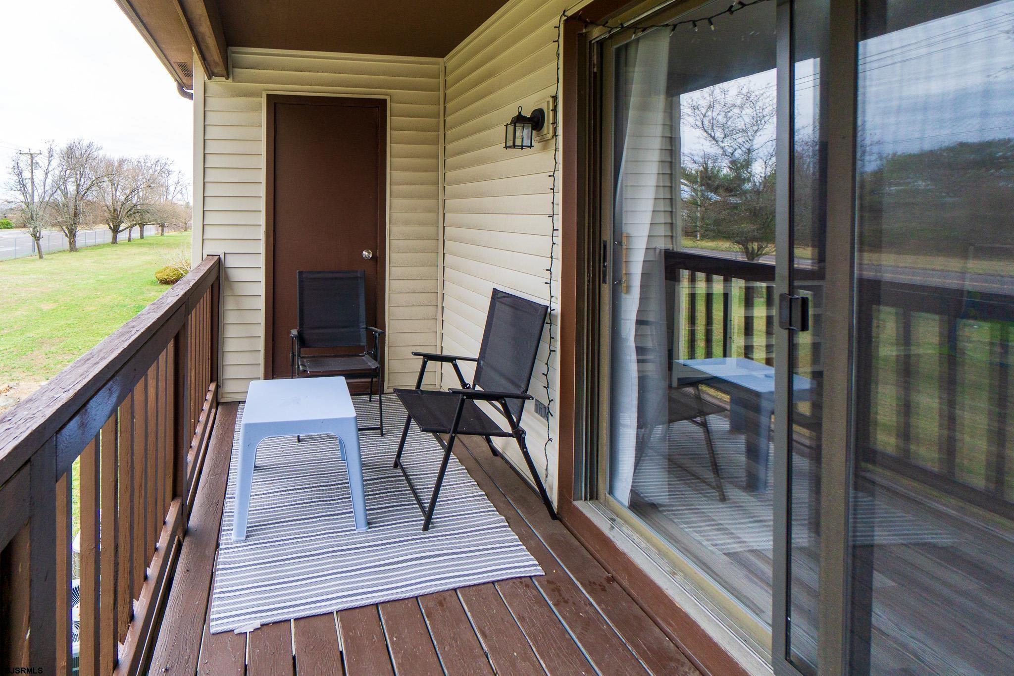 3137 Woodlands Drive, Unit 3137 Mays Landing, NJ 08330 - Photo 14 of 14 a view of a balcony with furniture