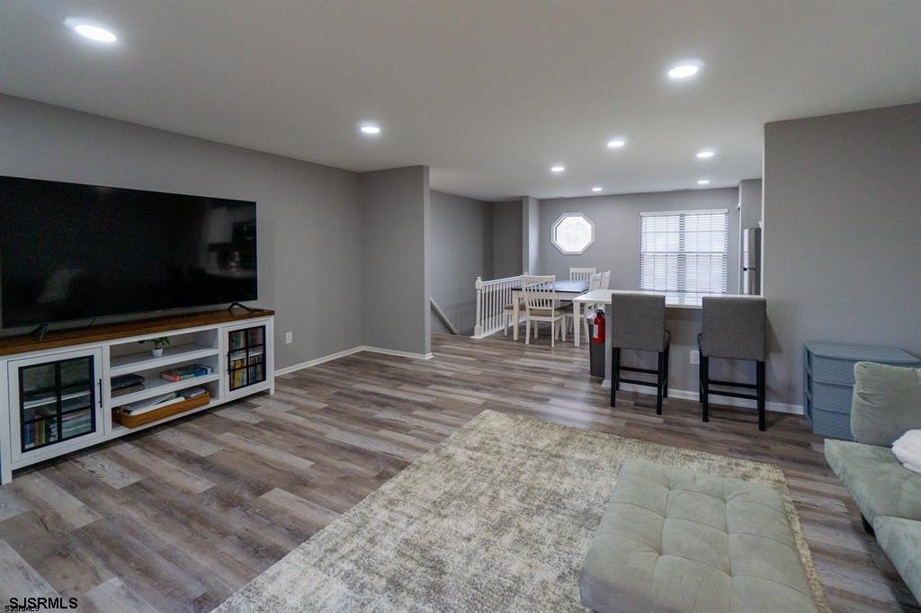 3137 Woodlands Drive, Unit 3137 Mays Landing, NJ 08330 - Photo 2 of 14 a view of a livingroom with furniture and a flat screen tv