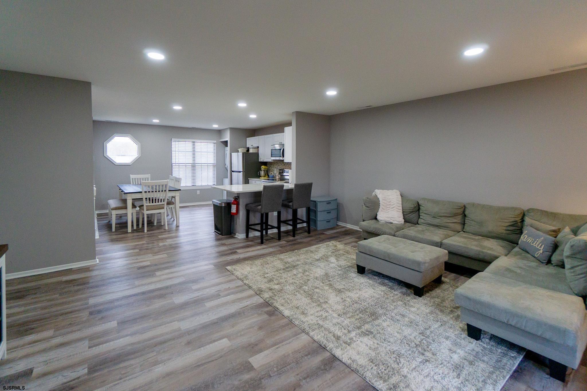 3137 Woodlands Drive, Unit 3137 Mays Landing, NJ 08330 - Photo 6 of 14 a living room with furniture and a wooden floor