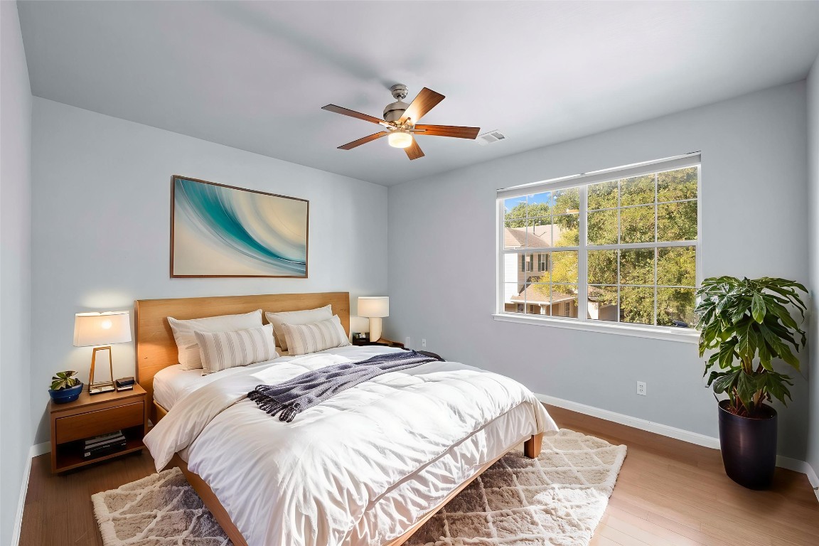 6704 Menchaca Road, Unit 29 Austin, TX 78745 - Photo 25 of 34 a bedroom with a bed and a window